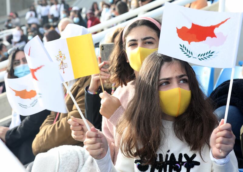 Young girls waving flags at Pope Francis' open air mass in Nicosia, Cyprus. EPA / KATIA CHRISTODOULOU