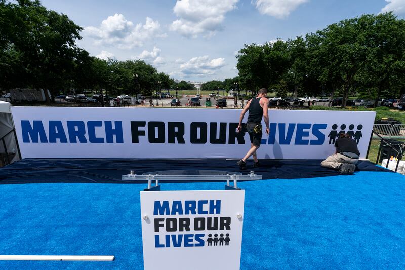 Workers set up for the March for Our Lives rally on the National Mall in Washington, on June 10, 2022. AP