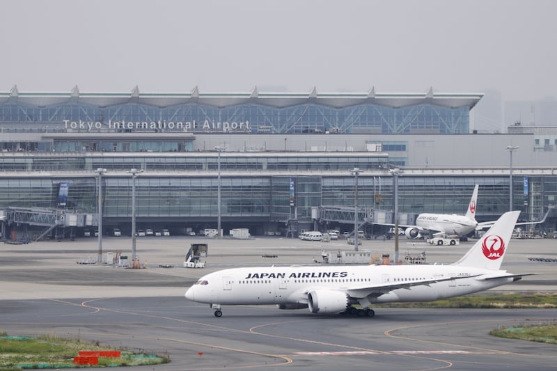 A Japan Airlines aircraft taxis at Haneda Airport in Tokyo, Japan. Bloomberg