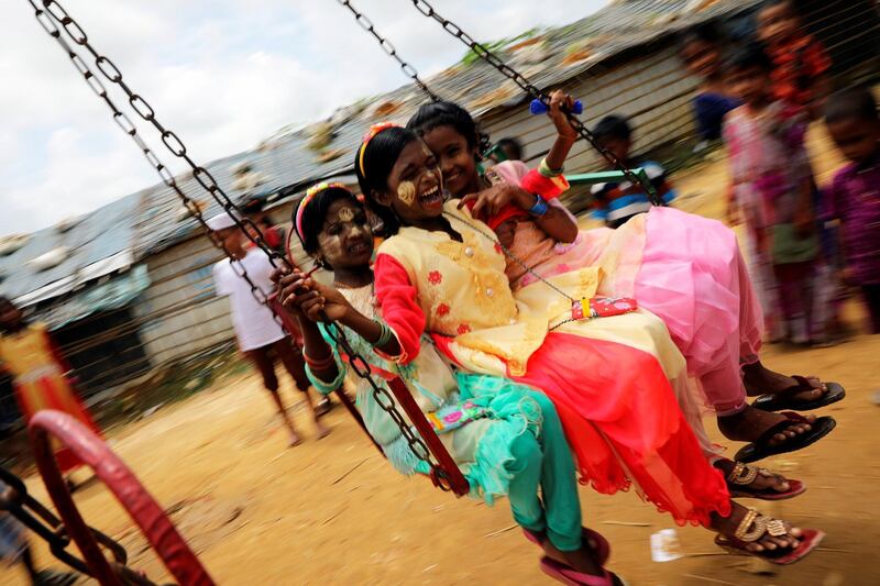 Rohingya refugee children ride on a swing ride on the day of Eid Al Adha in the Kutupalong refugee camp in Cox’s Bazar, Bangladesh. Reuters