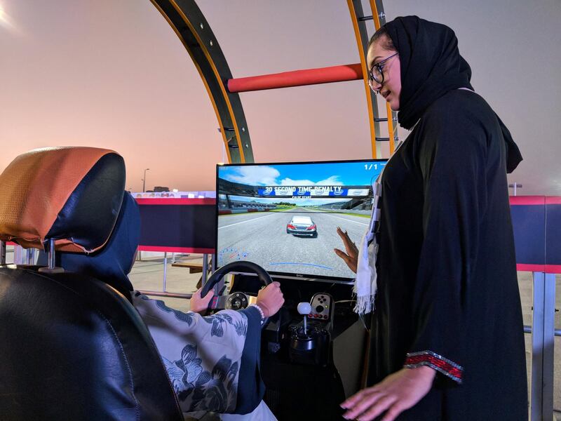 Rohood Bugis, as she takes to the wheel of the virtual training area in the CIc. 
Amina Abu Al Ola is the trainer advising her
