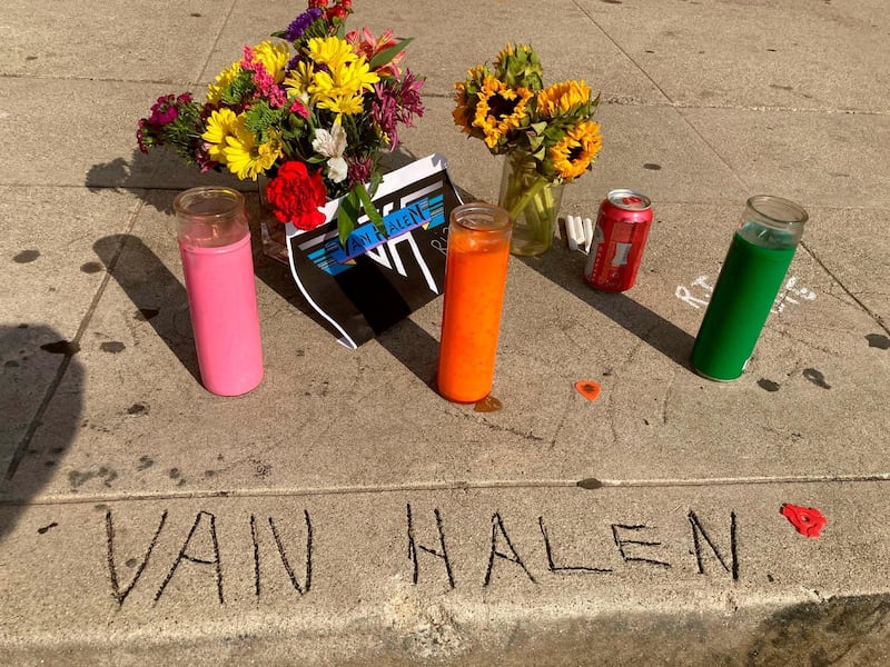 Legend has it that the name Van Halen, seen etched in concrete at the corner of Allen and Villa in Pasadena, California, was done by brothers Eddie and Alex Van Halen when they lived in Pasadena, California, in their younger years. A sidewalk memorial has begun. AP
