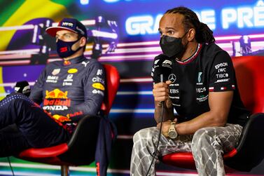 Mercedes' British driver Lewis Hamilton (R) and Red Bull's Dutch driver Max Verstappen (L) are seen during a press conference held after Brazil's Formula One Sao Paulo Grand Prix at the Autodromo Jose Carlos Pace, or Interlagos racetrack, in Sao Paulo, on November 14, 2021.  (Photo by Antonin Vincent  /  POOL  /  AFP)