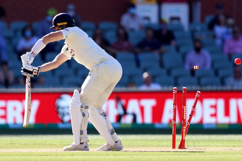 England's Chris Woakes is bowled by Jhye Richardson during the fifth day of the Adelaide Test. AP