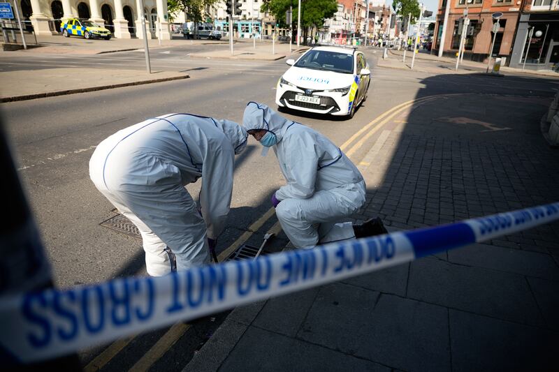 Forensic police search an area in the city centre. Getty 