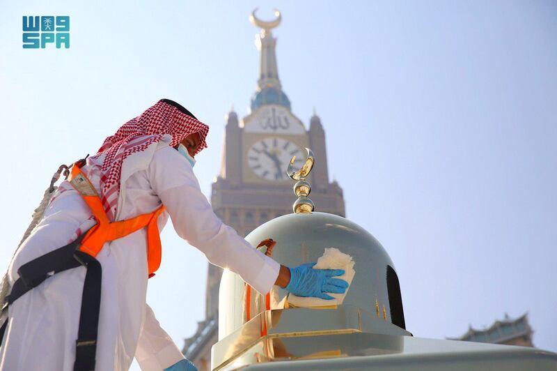 An official from the General Presidency for the Affairs of the Two Holy Mosques polishes the dome of Maqam Ibrahim, at the Kaaba in the Grand Mosque, in Makkah, Saudi Arabia. Reuters