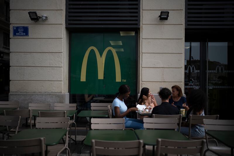 People eat at a McDonald's restaurant in Marseille, southern France. AP