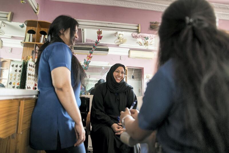 ABU DHABI, UNITED ARAB EMIRATES - AUGUST 16, 2018. 

Shazia Azeem, with her colleagues at Abeer Beauty & Henna salon in Baniyas.

(Photo by Reem Mohammed/The National)

Reporter: Anna Zacharias
Section:  NA