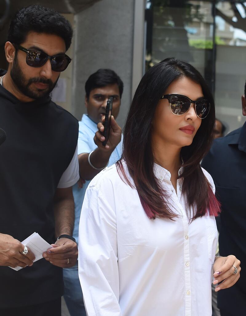 Bollywood actors Aishwarya Rai Bachchan and Abhishek Bachchan leave after casting their vote at a polling station during the fourth phase of general election in Mumbai on April 29, 2019. AFP