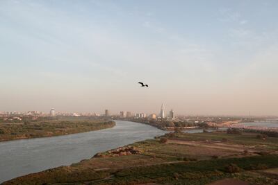 FILE PHOTO: A bird flies over the convergence between the White Nile river and Blue Nile river in Khartoum, Sudan, February 17, 2020. REUTERS/Zohra Bensemra/File Photo
