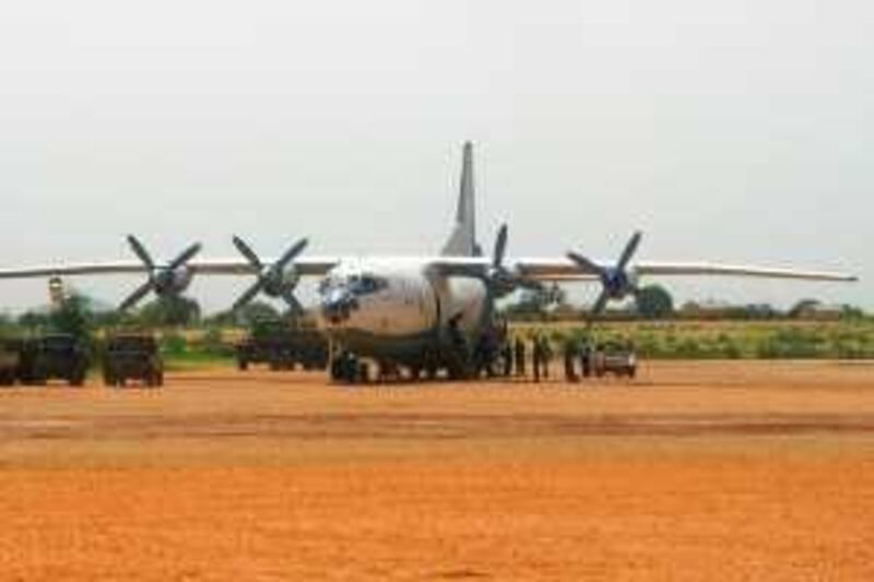 This photograph from Amnesty International purports to show an Antonov 12 transport plane delivering military supplies to the western Darfur town of Geneina in Sudan, in July 2007.  Sudan's government is violating a United Nations embargo on introducing offensive military hardware into the western region of Darfur, Amnesty International said today, citing photographic evidence.  Source: Amnesty International via Bloomberg News.