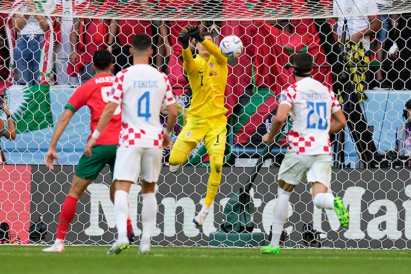 Croatia's goalkeeper Dominik Livakovic deflects the ball. AP