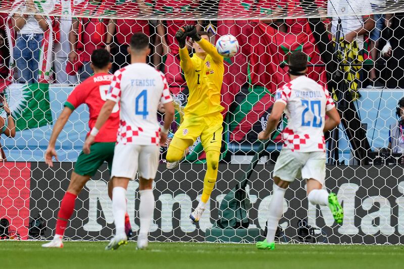 Croatia's goalkeeper Dominik Livakovic deflects the ball. AP