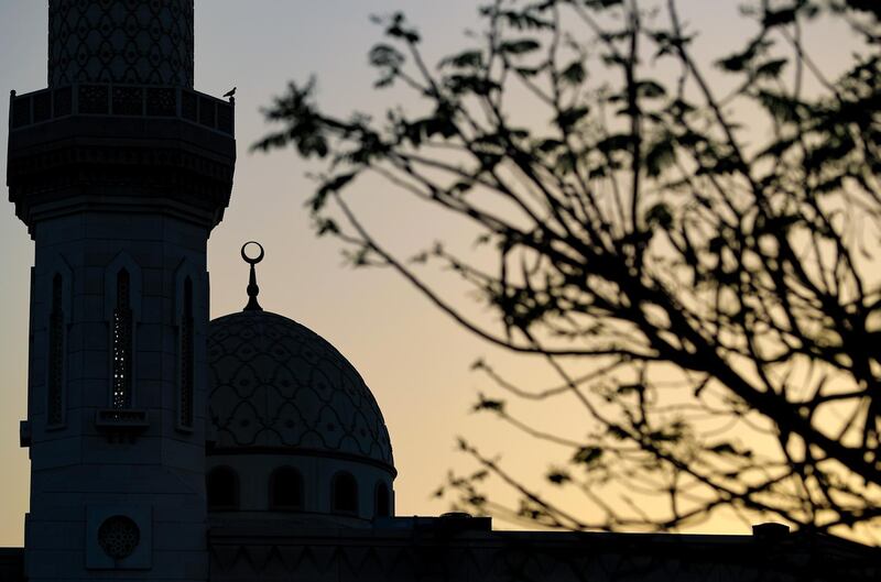 Dubai, United Arab Emirates - Reporter: N/A. News. The sun sets over a mosque on the last evening before Ramadan in Dubai. Monday, April 12th, 2021. Dubai. Chris Whiteoak / The National