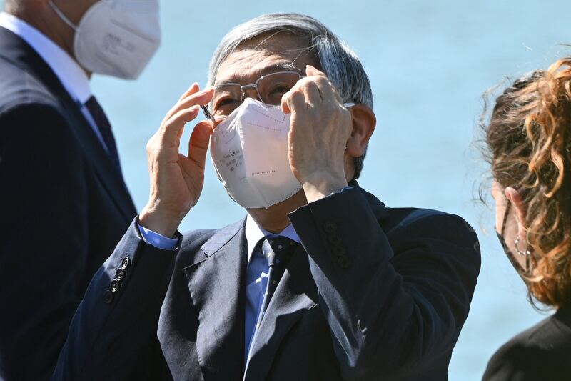 Haruhiko Kuroda, governor of Bank of Japan, adjusts his glasses as he arrives for the meeting.