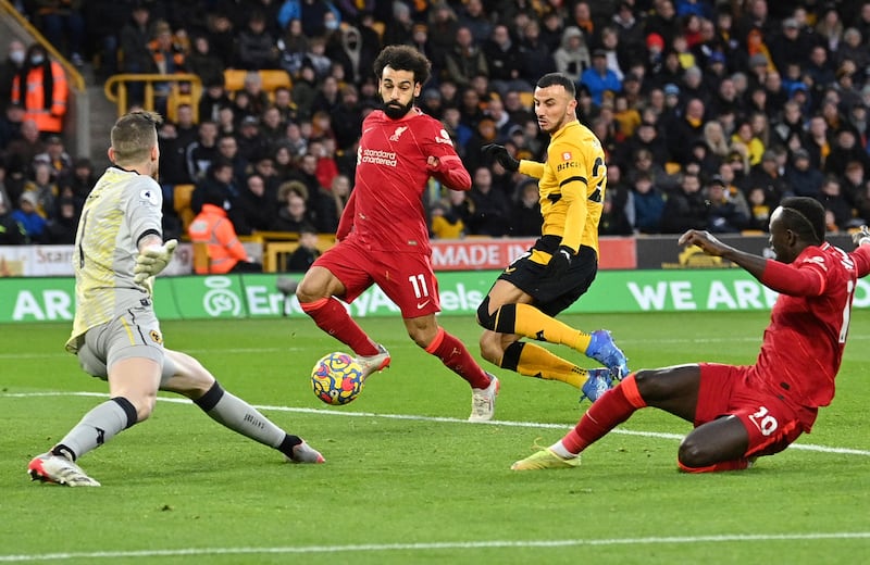 Liverpool's Mohamed Salah and Sadio Mane miss a chance to score. AFP