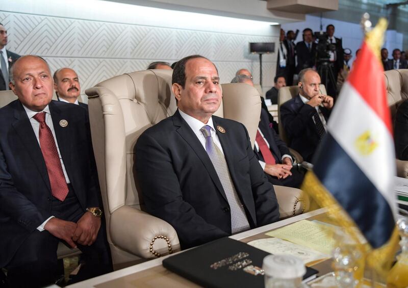 Egyptian President Abdel Fattah El Sisi, centre, and his Foreign Minister Sameh Shoukry, left, attend the oppening of the 30th Arab Summit in Tunis, Tunisia. AP