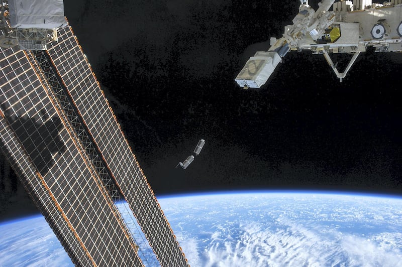 A set of NanoRacks CubeSats is photographed by an Expedition 38 crew member after the deployment by the NanoRacks Launcher attached to the end of the Japanese robotic arm. Wikicommons