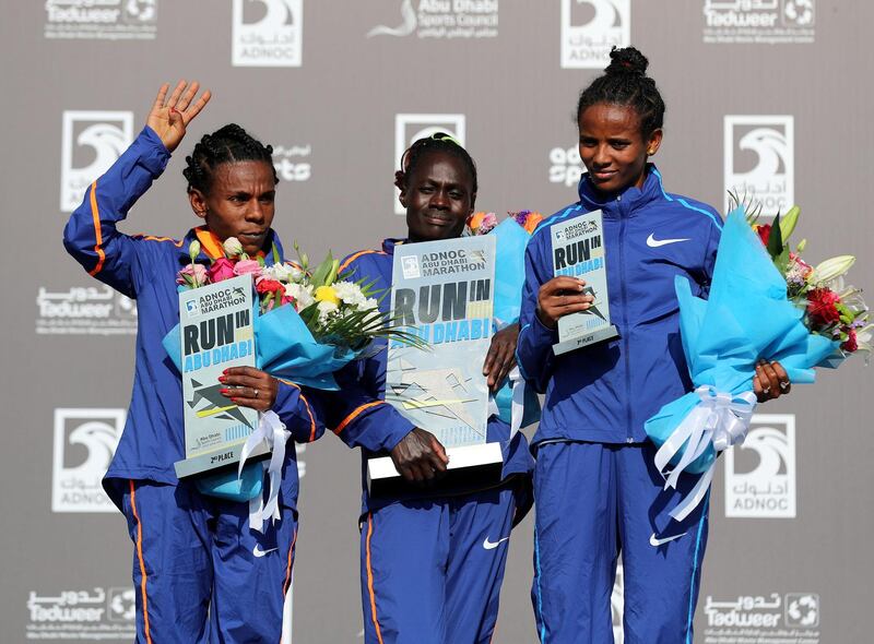 Abu Dhabi, United Arab Emirates - December 06, 2019: 1st, 2nd 3rd to Wude Yimer Ayalew (L, 2nd), Vivian Kiplagat (m, winner) and Yeshi Chekole Kalayu (L, 3rd) for the womens ADNOC Abu Dhabi marathon 2019. Friday, December 6th, 2019. Abu Dhabi. Chris Whiteoak / The National