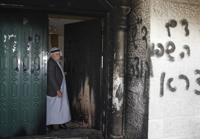 A mosque was vandalised by Israeli settlers in the West Bank village of Deir Istiya, near the Jewish settlement of Ariel, on Wednesday. Abed Omar Qusini / Reuters 