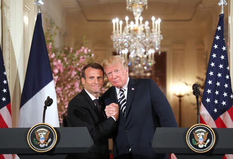 TOPSHOT - US President Donald Trump and French President Emmanuel Macron hold a joint press conference at the White House in Washington, DC, on April 24, 2018. / AFP PHOTO / Ludovic MARIN