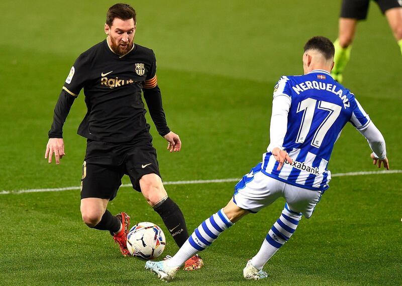 Barcelona's Lionel Messi challenges Real Sociedad's Martin Merquelanz. AFP