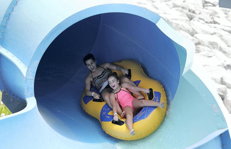 DUBAI , UNITED ARAB EMIRATES , MAY 12 – 2018 :- People taking water slides at the Laguna Waterpark in La Mer in Dubai.  ( Pawan Singh / The National )  For News/ Big Picture / Weekend. Story by Salam Al Amir
