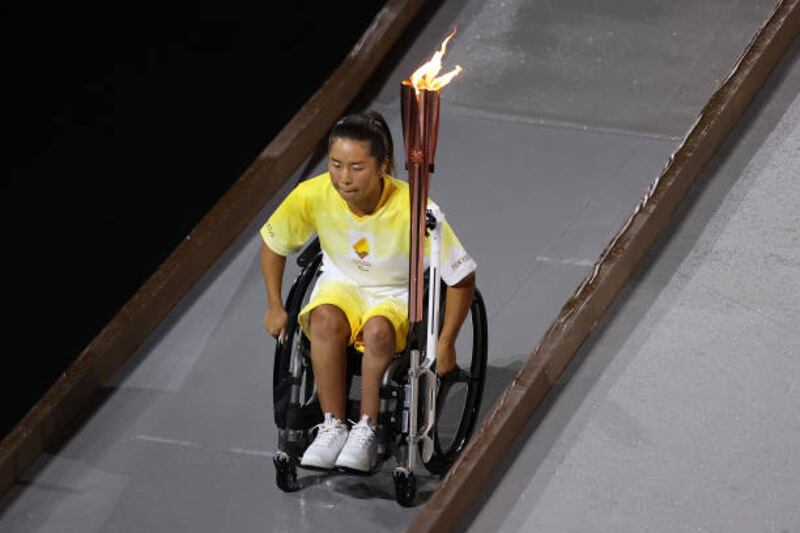 Yui Kamiji of Team Japan prepares to light the Paralympic flame. Getty