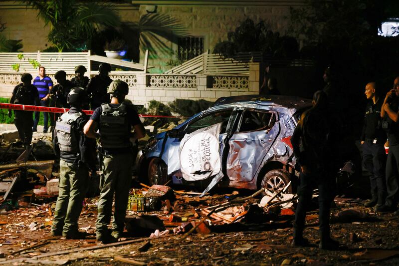 Israeli security forces cordon off a neighbourhood in Ashkelon hit by a rocket. AFP