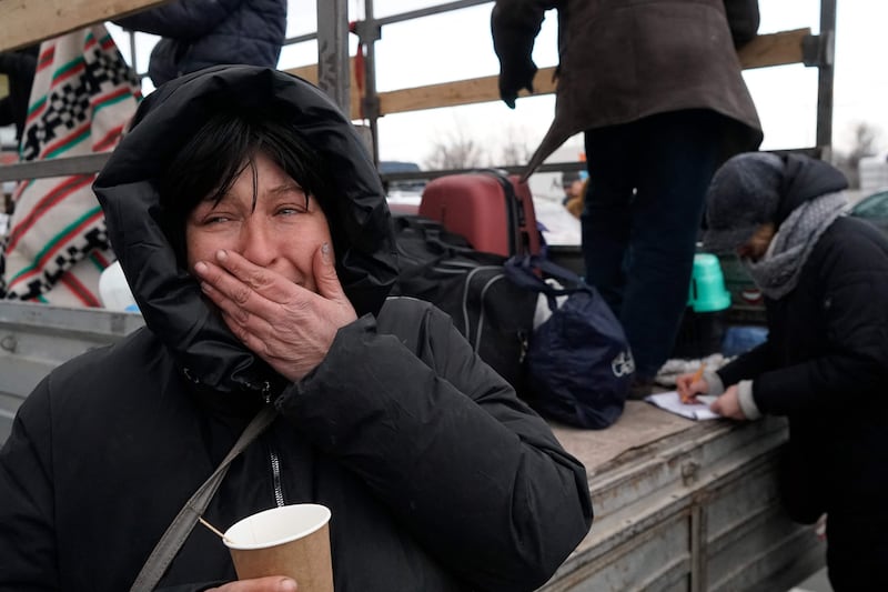 Evacuees from Mariupol are seen upon arrival at the car park of a shopping centre on the outskirts of the city of Zaporizhzhia, which is now a registration centre for displaced people. AFP