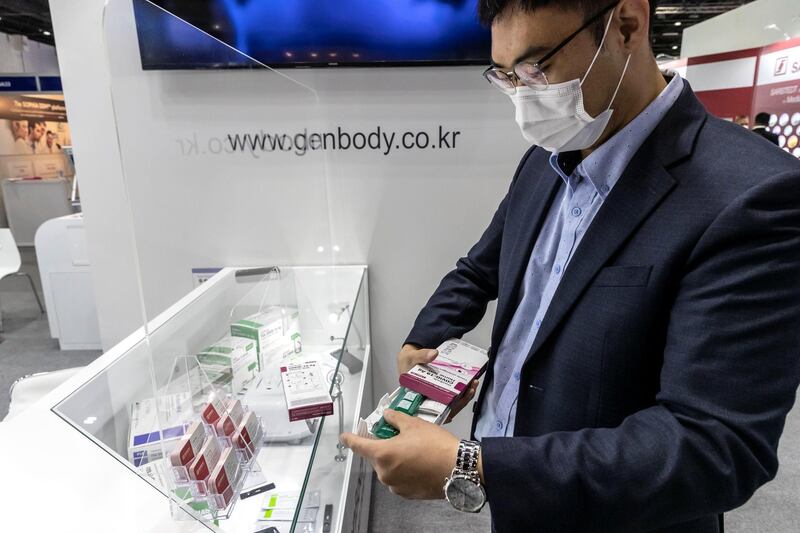 The opening day of Arab Health 2021 at the Dubai World Trade Center on June 21st, 2021. 
Steve Lee, Regional Sales Manager of Gen Body Inc from Korea holds one of their Covid-19 home test kits.
Antonie Robertson / The National.
Reporter: Nic Webster for National