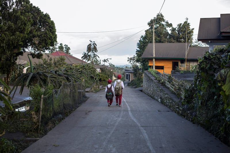 Indonesian pupils walk to school in Agam district, West Sumatra, which has been blanketed by volcanic ash from the Mount Merapi eruption. EPA