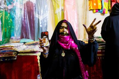 Liwa, United Arab Emirates, July 20, 2017:    Fatima al Hameli, an Emirati woman, at the traditional souq during the Liwa Date Festival in the Al Dhafra Region of Abu Dhabi on July 20, 2017. The festival runs from July 19th to 29th. Christopher Pike / The National

Reporter: Anna Zacharias
Section: News