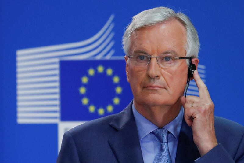 FILE PHOTO: European Union's chief Brexit negotiator Michel Barnier listens to a translation during a news conference in Brussels, Belgium July 26, 2018. REUTERS/Yves Herman/File Photo