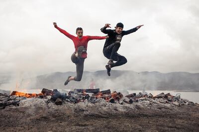 A handout photo of people jumping over fire at Spartan Race (Courtesy: Reebok) *** Local Caption ***  al17fe-spartan-race01.jpg