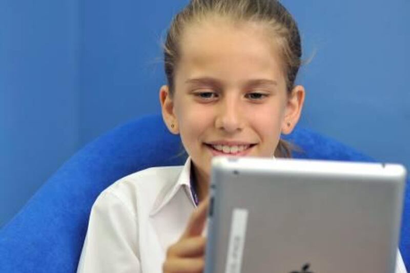 Eleven year old Josie Proto uses an IPad as part of her classroom activities at the GEMS Royal Dubai School in Dubai, United Arab Emirates on Monday, Dec. 19, 2011.  Photo: Charles Crowell for The National