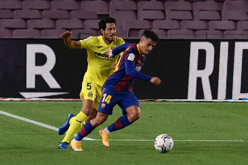 Villarreal's Spanish midfielder Daniel Parejo challenges Barcelona's Brazilian midfielder Philippe Coutinho. AFP