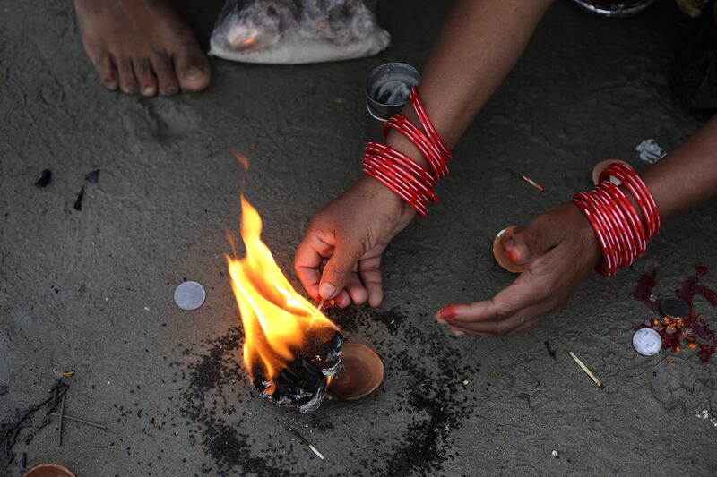 Indian devotees perform rituals. EPA