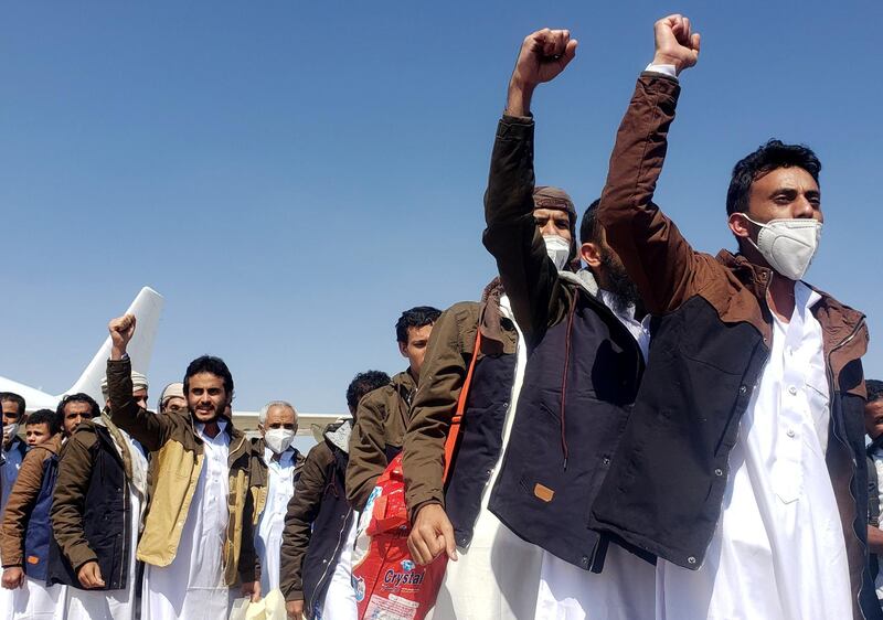 Freed Saudi-led coalition prisoners shout slogans as they arrive, after release in a prisoner swap, at Sayoun airport, Yemen October 15, 2020. Reuters
