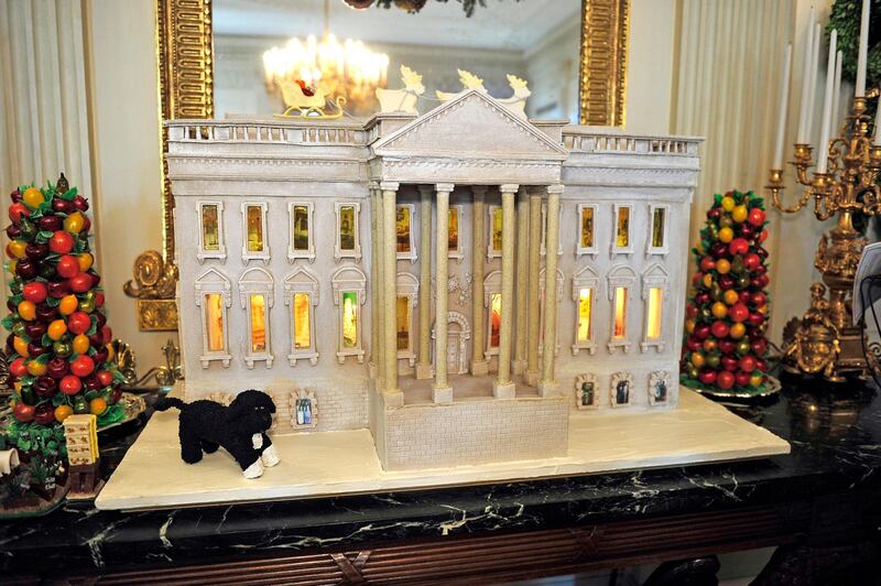 28 Nov 2012, Washington, DC, USA --- The White House Gingerbread House, part of the 2012 White House Christmas decorations, on display in the State Dining Room in Washington, DC on Wednesday, November 28, 2012. It is constructed with over 175 pounds of gingerbread and modified gingerbread. The 300 pound (136.1kg) house contains 50 pounds (22.7kg) of chocolate. A combination of wheat, rye, and white-flour gingerbread mimic the color of the original sandstone that was painted white in 1798. Credit: Ron Sachs / CNP --- Image by © Ron Sachs/Corbis