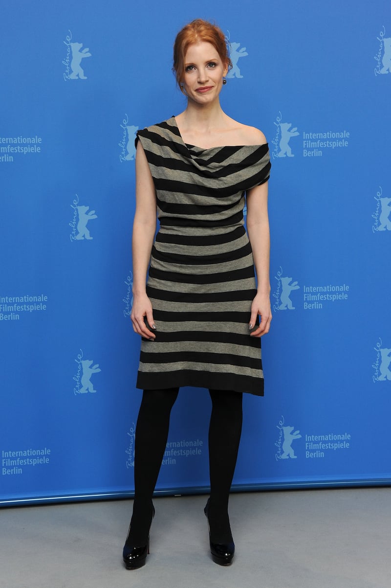 Jessica Chastain, in a grey and black striped dress, attends the 'Coriolanus' photocall during the 61st Berlin International Film Festival on February 14, 2011. Getty Images