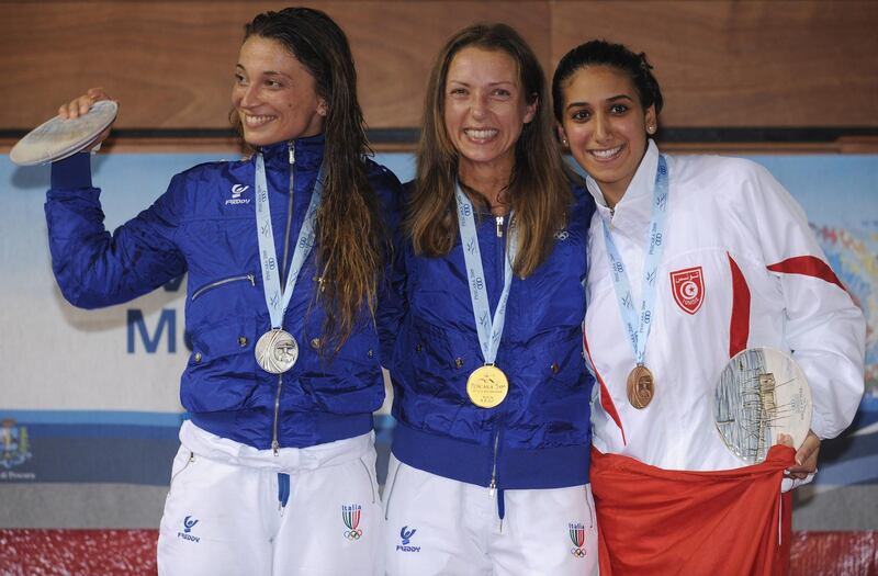 PESCARA, ITALY - JUNE 29:  Silver medalist Margherita Granbassi of Italy, Gold medalist Valentina Vezzali of Italy and Bronze medalist Ines Boubakri of Tunisia stands on the podium during the medal ceremony in the Women's individual foil at the Pineto Palasport on June 29, 2009 in Pescara, Italy.  (Photo by Getty Images)