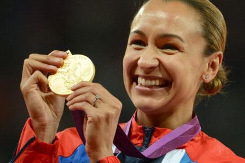 British athlete Jessica Ennis shows off her heptathlon gold medal.
