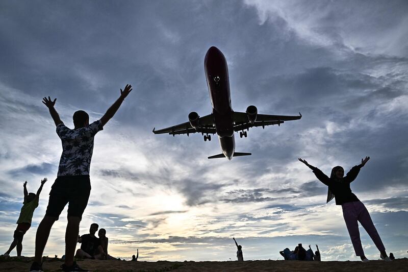 A passenger jet prepares to land at Phuket International Airport, Thailand. Investing in the travel industry could be considered an alternative version of a loyalty programme, experts say. AFP