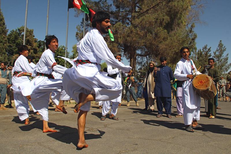 A group of Afghan dancers celebrate the Independence Day in Helmand, Afghanistan.  Watan Yar / EPA.