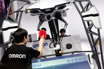 epa07478383 A table tennis player plays against a robot at the booth of the company 'Omron' during the Hannover Industry Fair (Hannover Messe) in Hanover, northern Germany, 01 April 2019. From 01 April to 05 April, 6,500 exhibitors from 75 countries show their products during one of the World's leading fairs for industrial goods. The main focus of the Hannover Messe 2019 is on Artificial Intelligence and the new mobile standard 5G.  EPA/JENS SCHLUETER