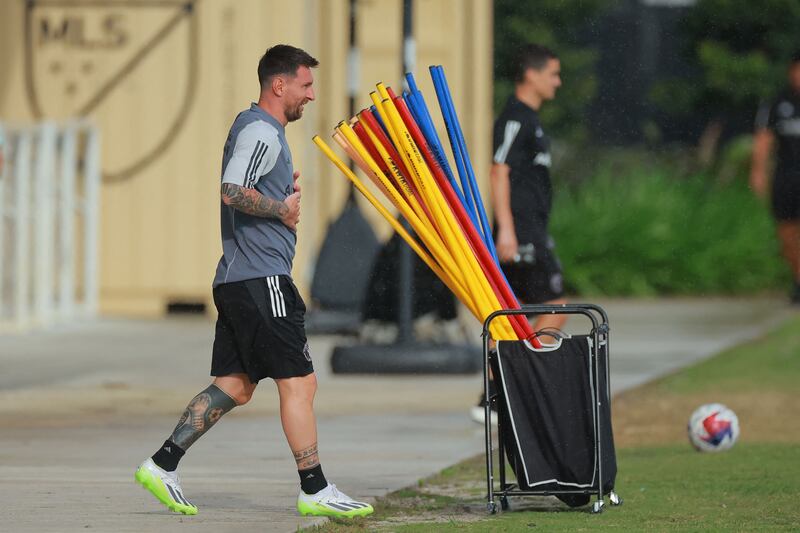 Lionel Messi enters the pitch ahead of a training session with his new Inter Miami teammates. AFP