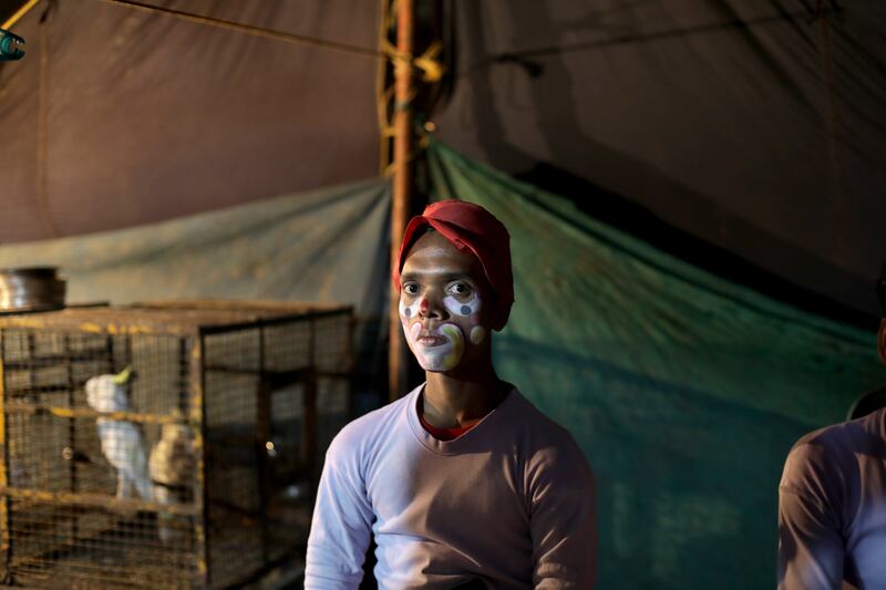 Clown Korim Sekh pauses for a moment of serious reflection at the Ajanta Circus, the only one in Kolkata, India, that has managed to return since the start of the Covid-19 pandemic. EPA