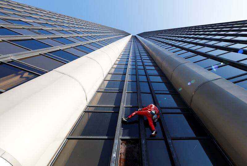 French 'Spiderman' Alain Robert climbs Montparnasse Tower in Paris to highlight the fuel and energy crisis amid weeks-long union-led blockades of petrol depots. Reuters