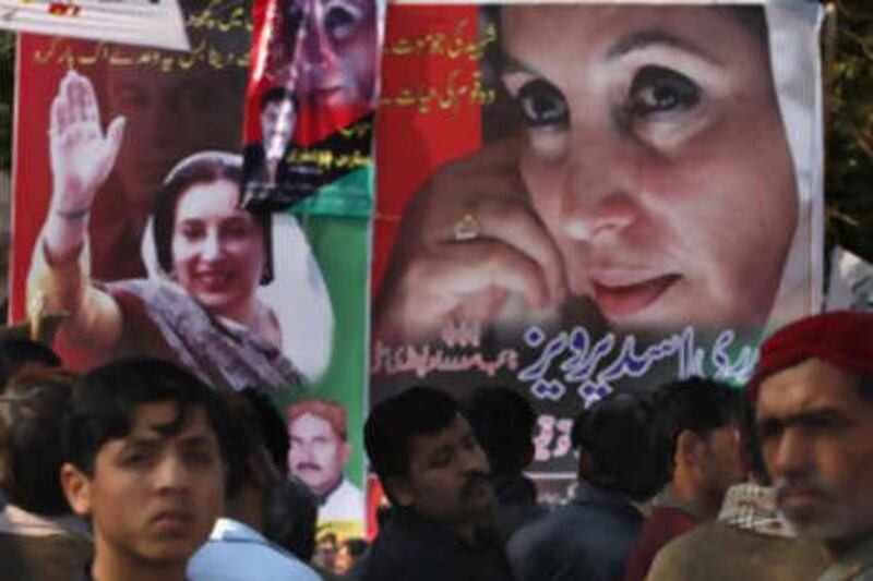 Supporters of Pakistan's slain former Prime Minister Benazir Bhutto arrive to attend a prayer ceremony at the site where she was assassinated in Rawalpindi, Pakistan, Saturday, Dec 27 2008.  More than 150,000 people gathered at her mausoleum to mourn the loss of their leader one year ago.